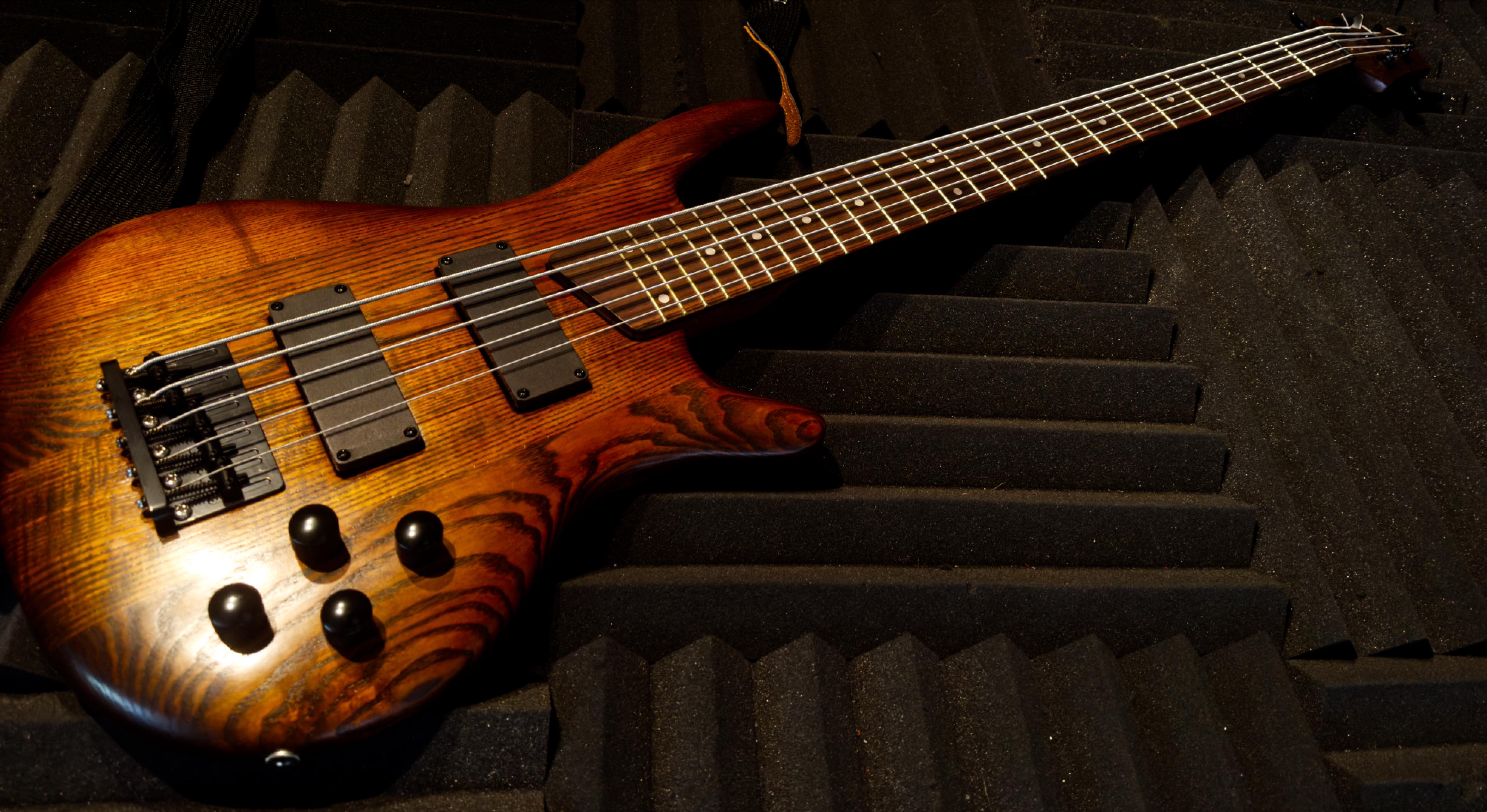 Award-winning custom-built bass guitar with flame maple finish and professional hardware